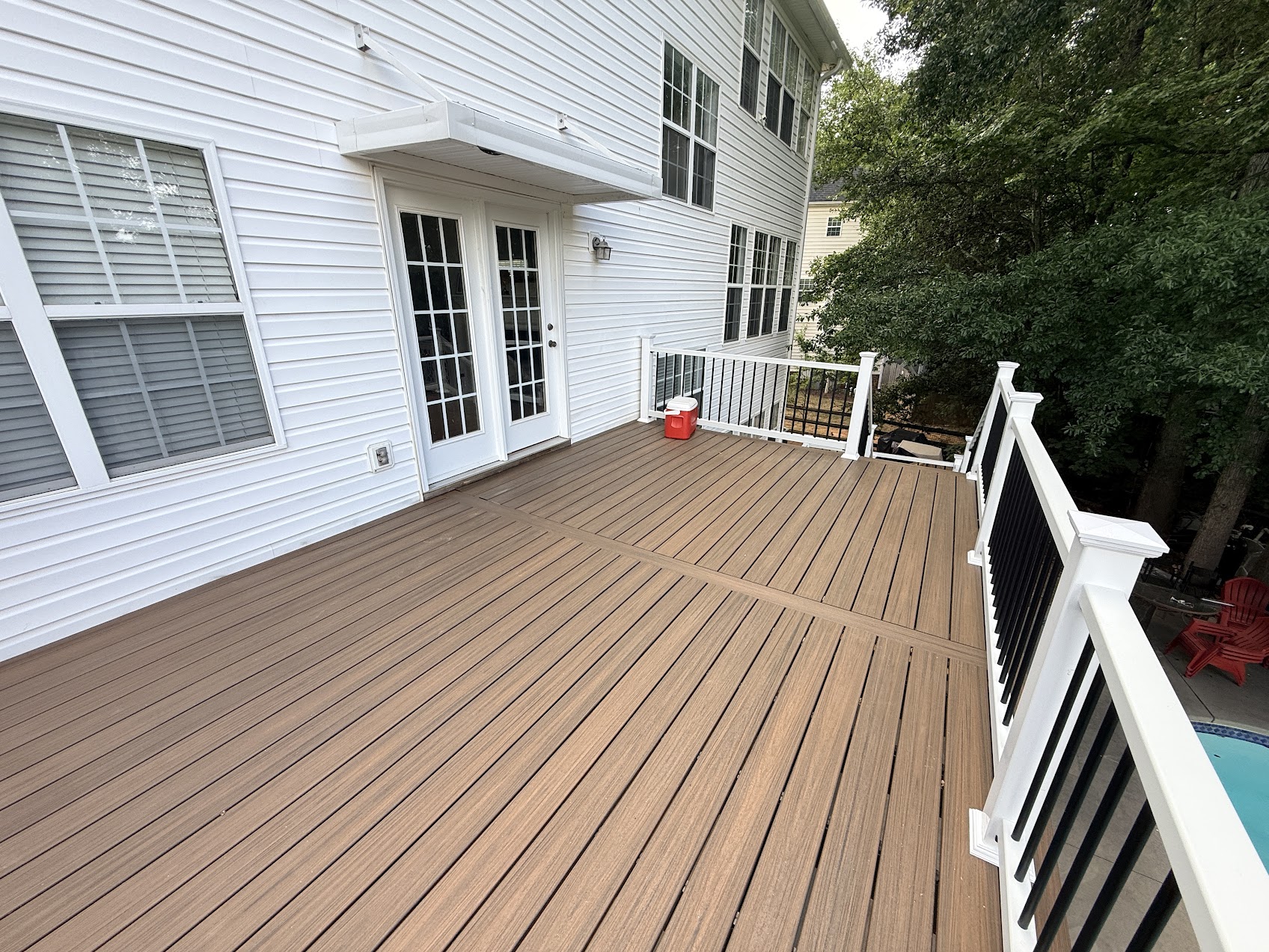 Pool deck after composite decking and railing by JeDi Works Charlotte NC