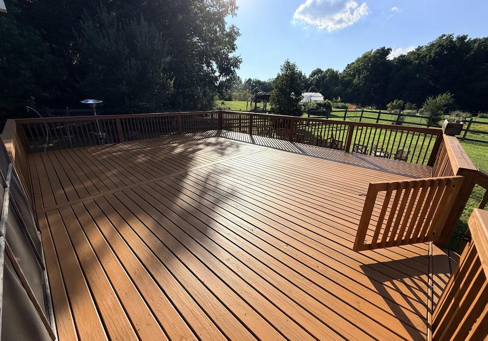 Large wood deck after sanding and staining by JeDi Works