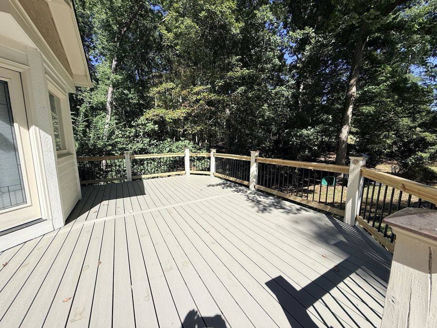 Gray composite deck resurfacing with new railing